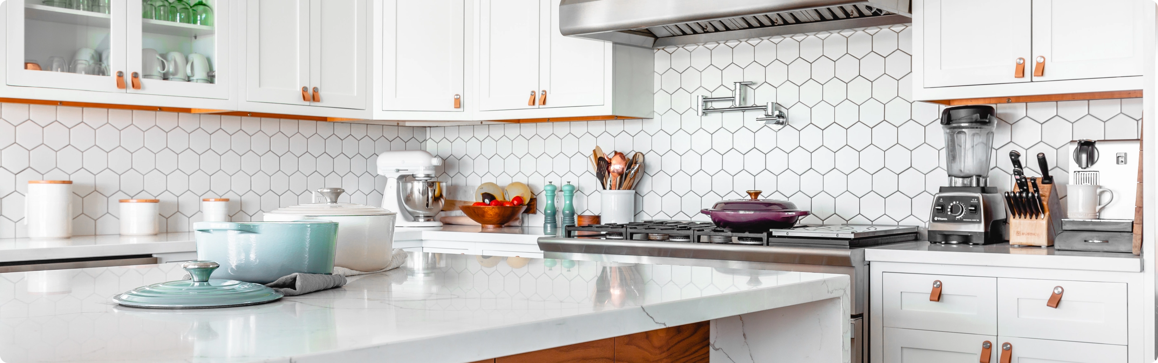 Modern kitchen renovation with hexagonal tile backsplash